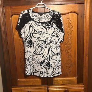 Black and white floral top with black strings for shoulders